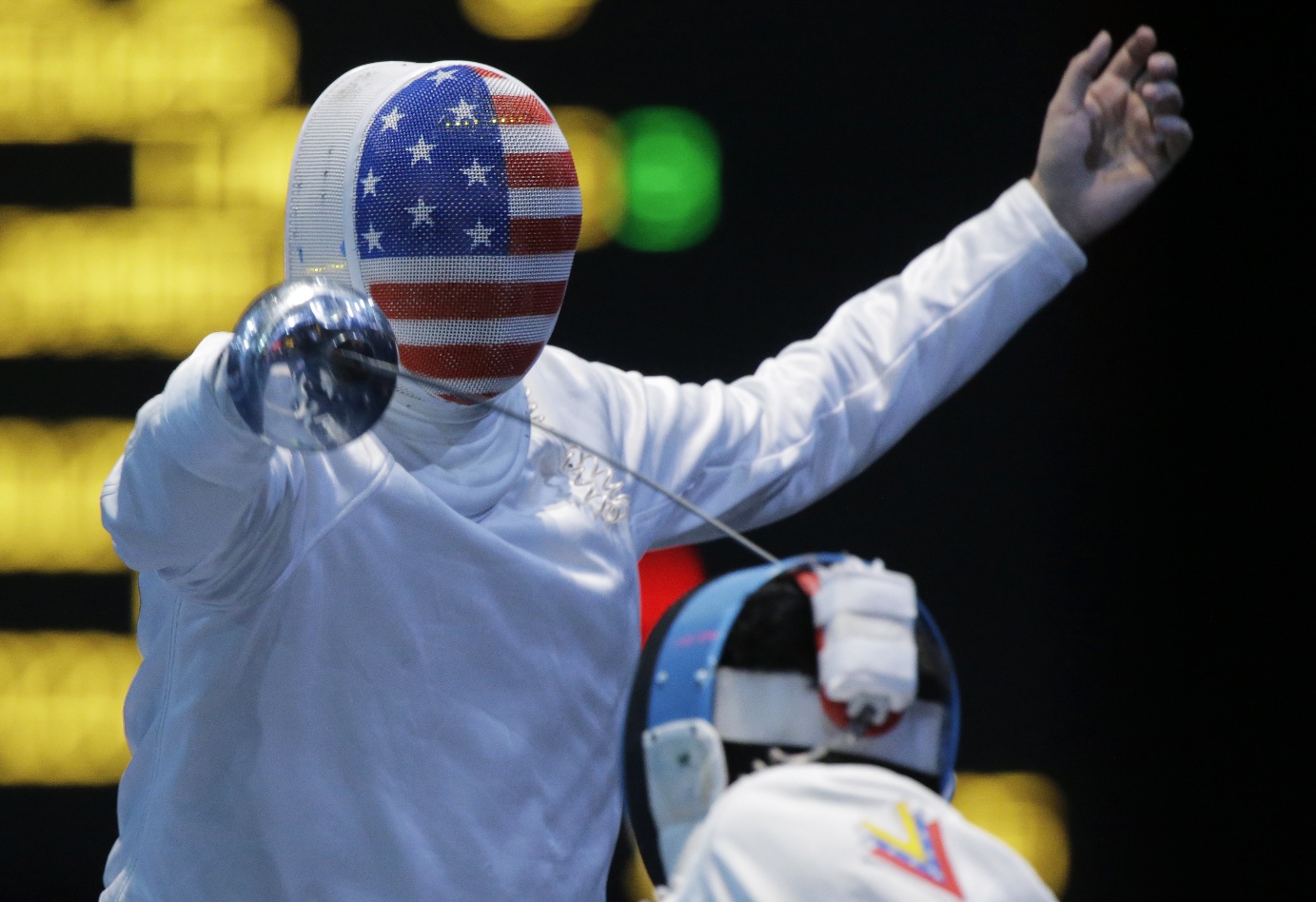 Vancouver's Seth Kelsey, left, competes against Venezuela's Silvio Fernandez during the men's individual epee fencing competition at the 2012 Summer Olympics, Wednesday in London.