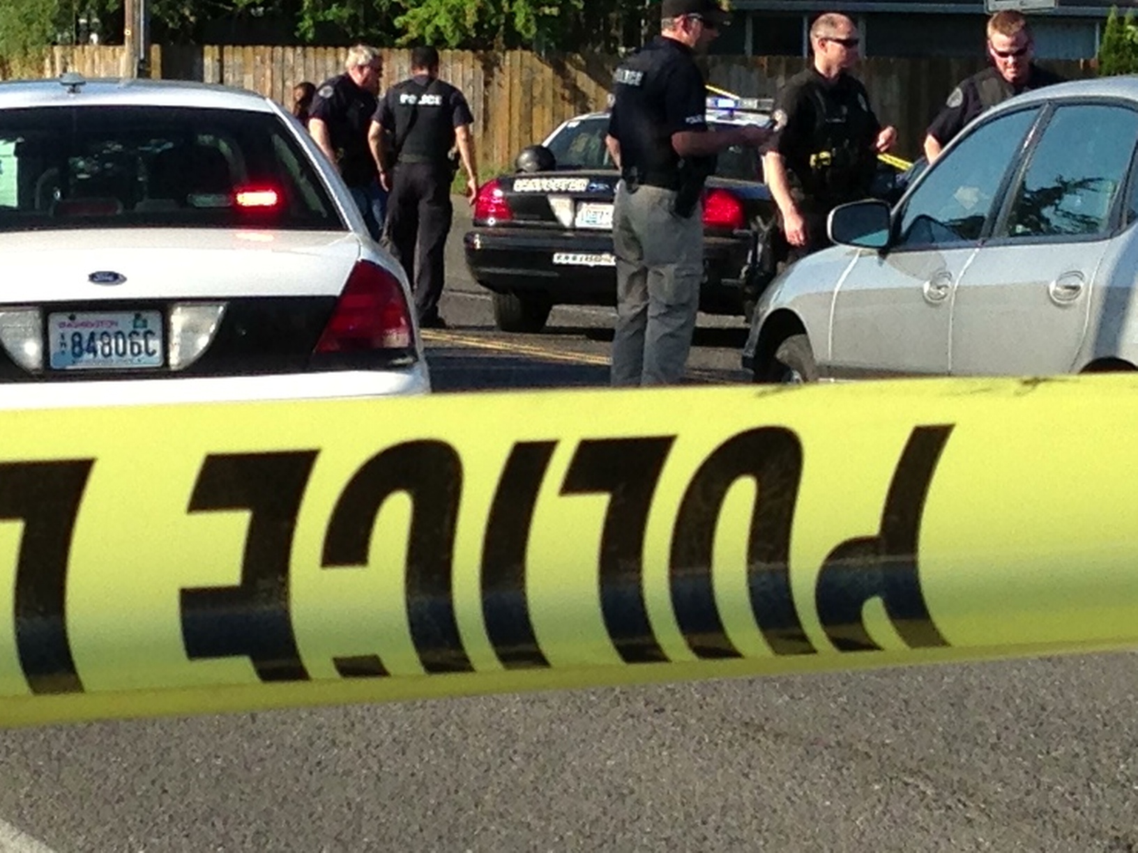 Law enforcement officials converge on the scene of a shooting Thursday in Vancouver's Fruit Valley neighborhood.