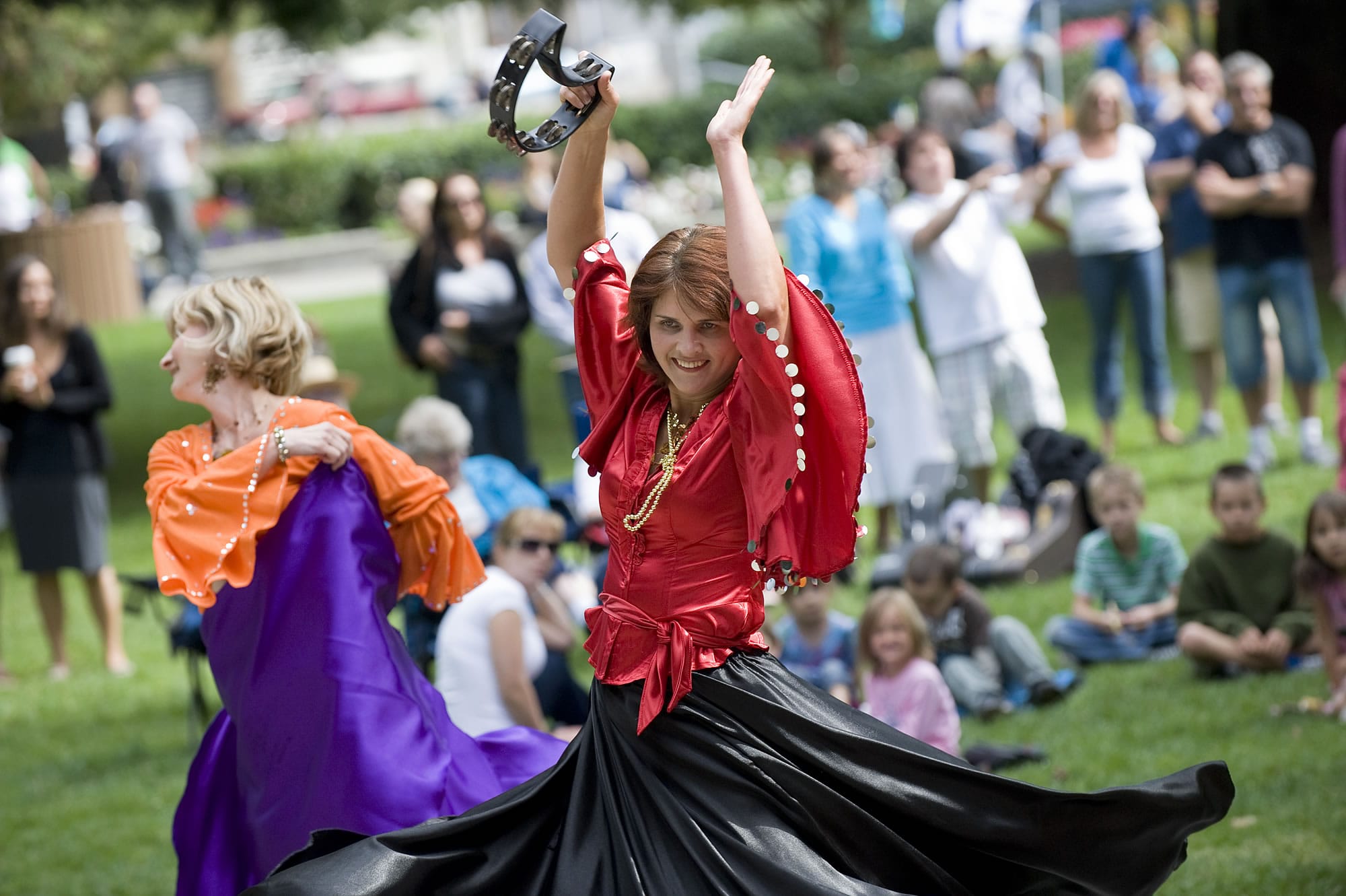 Katya Ponomareva, from the Russian Community Center in Redmond, entertains with a traditional dance at the Russian-American cultural festival in Esther Short Park in 2010.