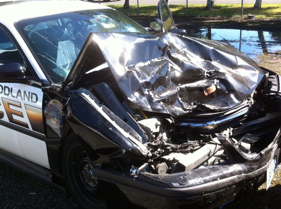 An on-duty Woodland police officer suffered minor injuries Tuesday when his cruiser was involved in a head-on crash on Pacific Avenue.
