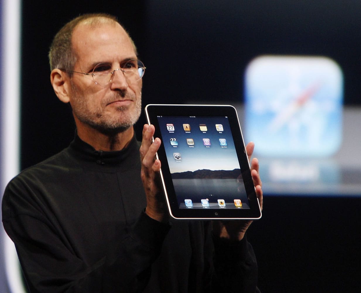 Apple CEO Steve Jobs shows off an iPad during an event in San Francisco in January 2010.