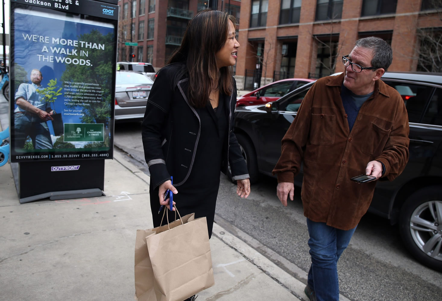 Maria Kim thanks UberEats driver Jim Butler for delivering her lunch in Chicago on Dec. 22.