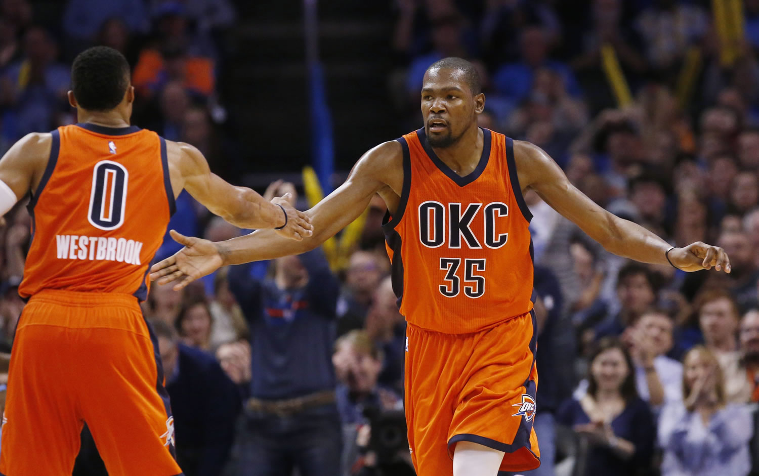 Oklahoma City Thunder forward Kevin Durant (35) slaps hands with Russell Westbrook (0) following a basket against the Memphis Grizzlies in Oklahoma City, Wednesday, Jan. 6, 2016. Oklahoma City won 112-94.