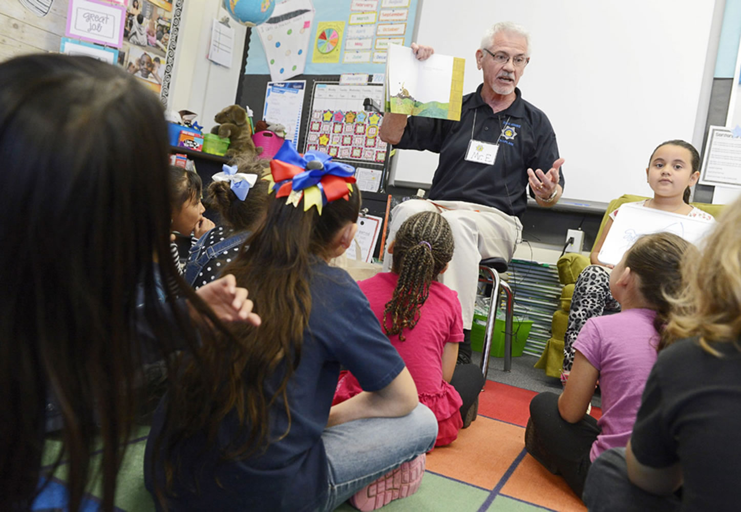 John Edmondson with the Fresno Police Chaplaincy reads to a first-grade class Jan. 15 at Pyle Elementary School in Fresno, Calif.