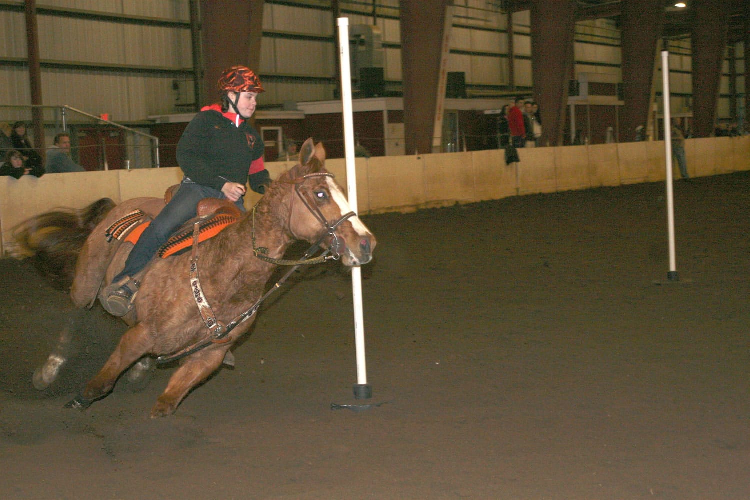 Washougal Equestrian Team President Felicia Harrison leads Tucker between the poles Saturday, in the first District Three WAHSET meet at the Clark County Fairgrounds.