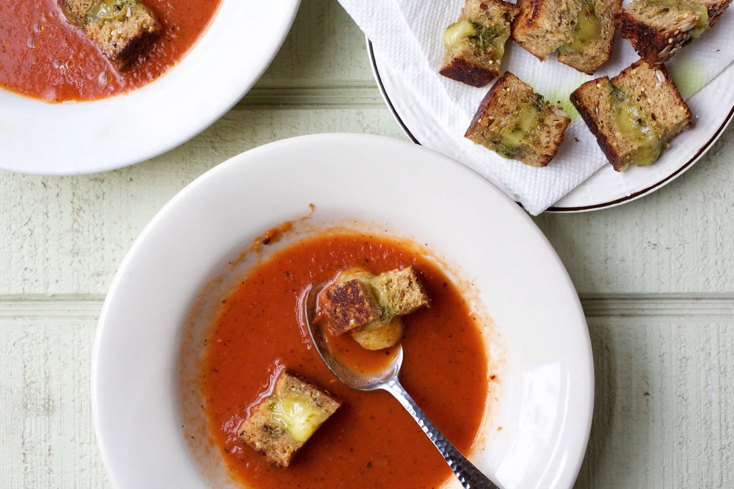 Tomato soup with grilled Havarti cheese croutons.