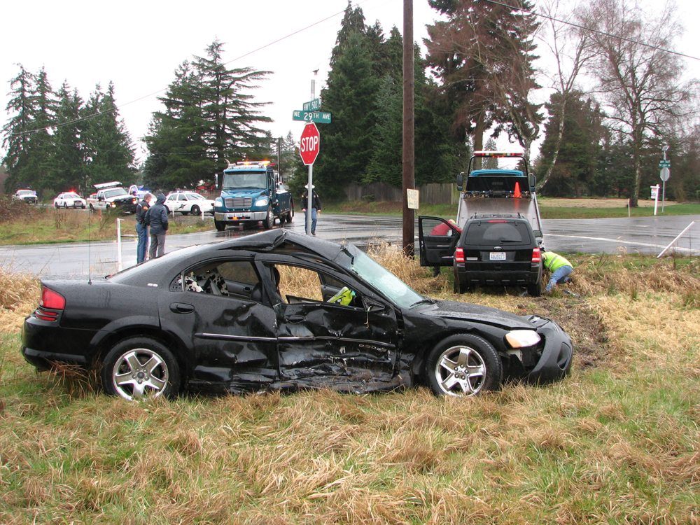 Photo by Washington State Patrol 
 A 2001 Dodge Stratus sits totaled at Northeast state Highway 502, aka 219th Street, and 29th Avenue on Monday after a two-car collision that injured four people, two of them children ages 4 and 5.
