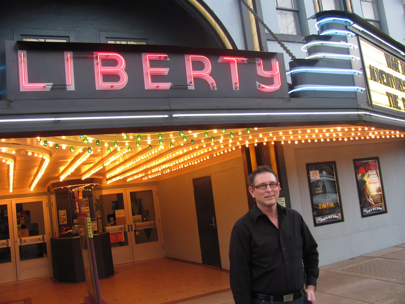 Rand Thornsley hopes more people will view movies at the Liberty Theatre, in downtown Camas. Thornsley, managing director of Rootstock Capital Management, LLC., signed a five-year lease on the theater in January 2011. Green lights have been added to the theater's entryway this month, to celebrate St. Patrick's Day.