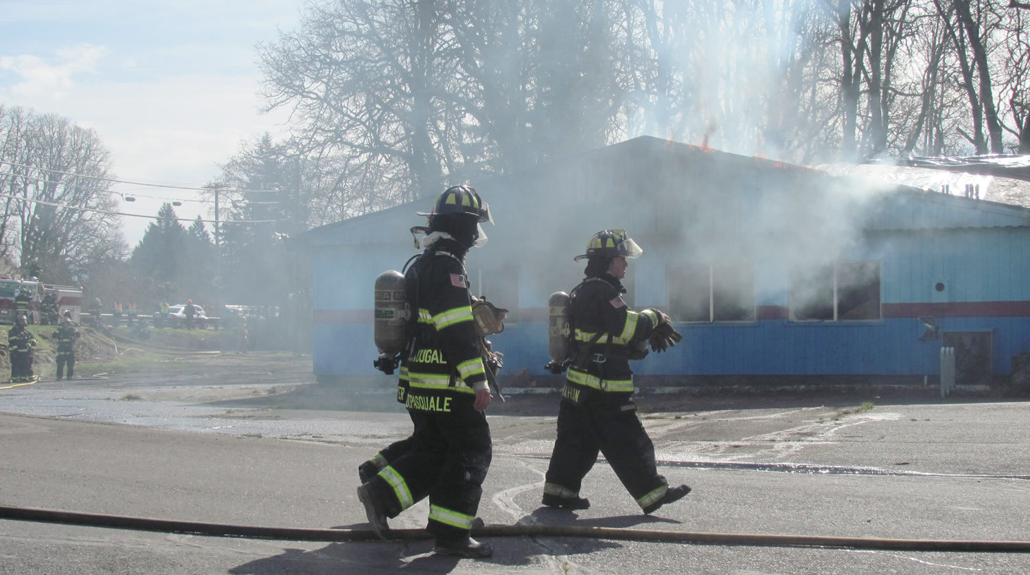Firefighters make final preparations for the controlled burn of the former Riverside Bowl building in Camas along Northeast Third Avenue. The facility was originally built in 1947, and when it was destroyed on Saturday it was one of the largest practice burns in Camas history with smoke visible from several miles away. Personnel from the Camas and Washougal fire departments and  East County Fire and Rescue participated in the training exercise.