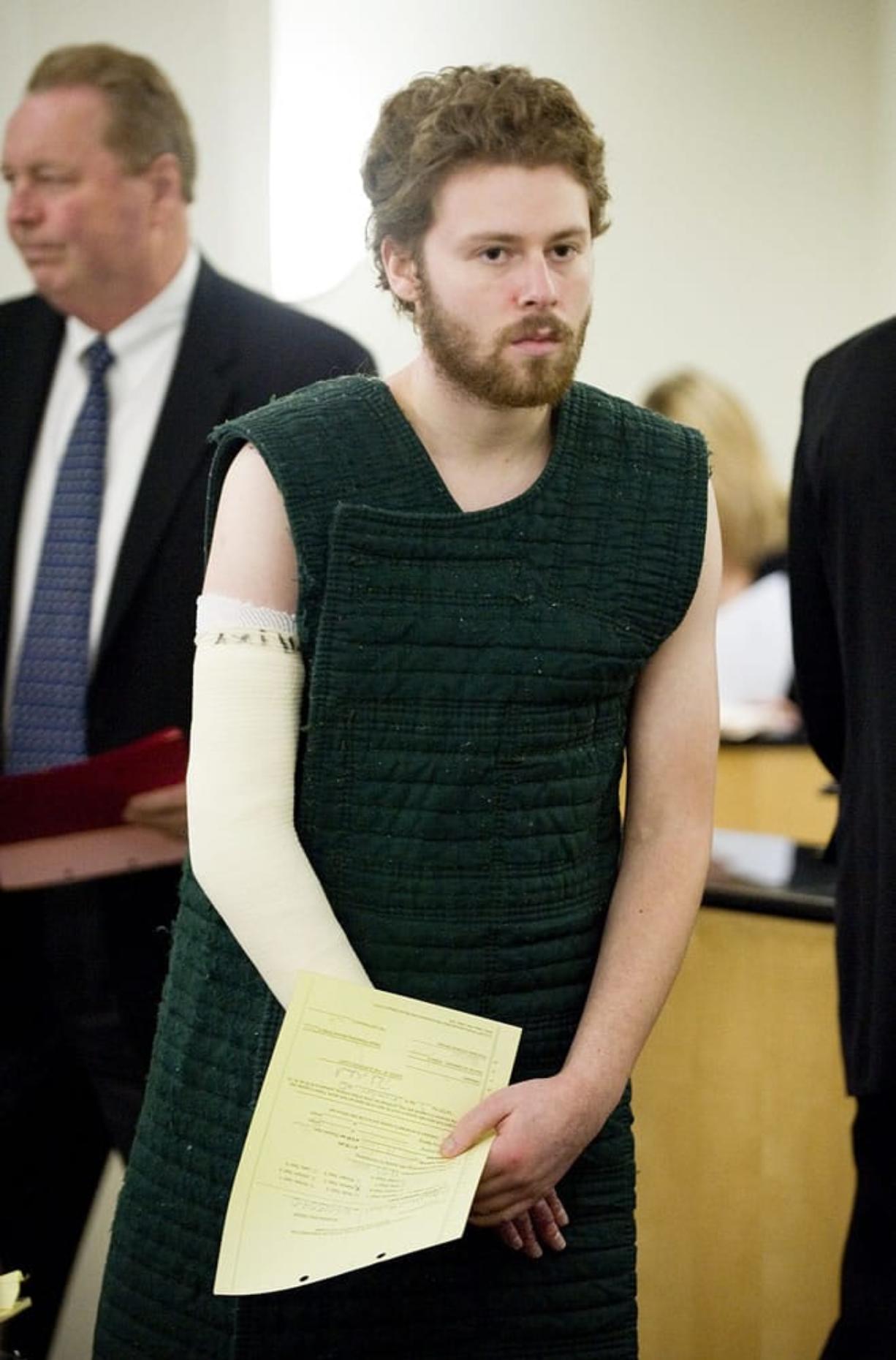 David Michael Miller, 24, pictured here at his arraignment in December 2010, was sentenced Thursday to about 17 years in prison for trying to kill his ex-girlfriend by burning her house down.