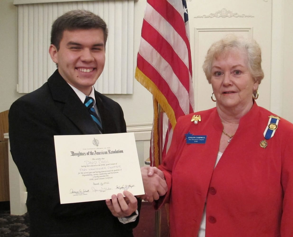 Washougal High School senior David Choi stands with Evelyn Campbell, regent of the Fort Vancouver Chapter of the Daughters of the American Revolution to receive his &quot;Good Citizen Award.&quot;