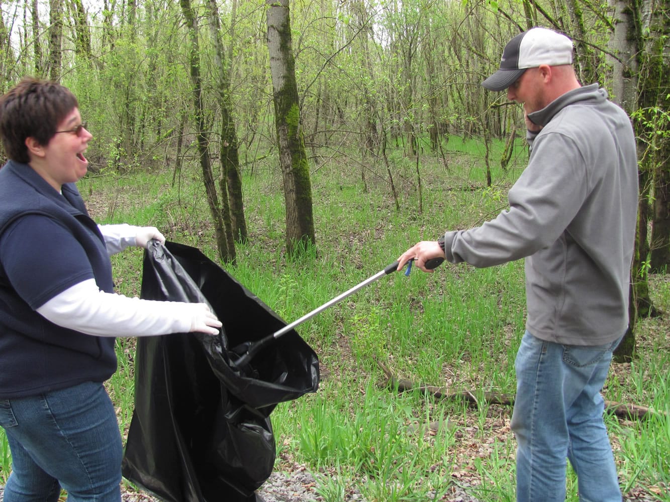 Debra Itzen and Jeramy Wilcox, Port of Camas-Washougal employees, participate in the Earth Day cleanup at Capt.