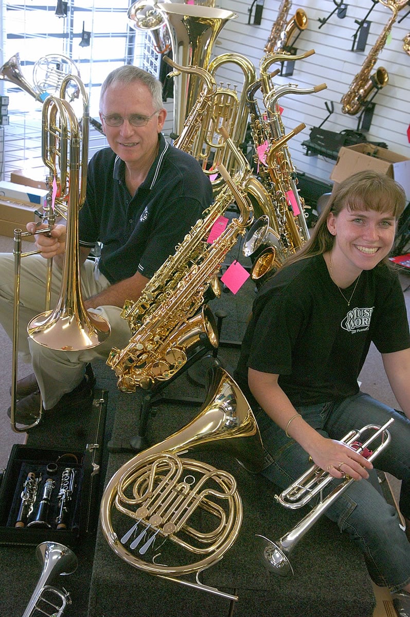 The late Jim Detchman, left, and his daughter, Jodi Goughnour, at Music World in 2004.