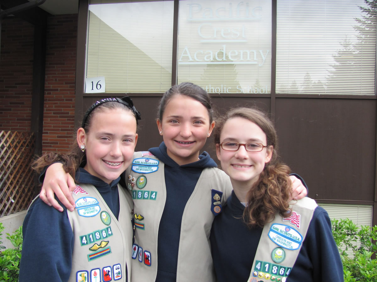 From left, Kamryn Wilson, Devyn Wilson and Maddie Scott, all students at Pacific Crest Academy, organized a craft drive for seriously ill children as a part of their Girl Scout troop community service project.