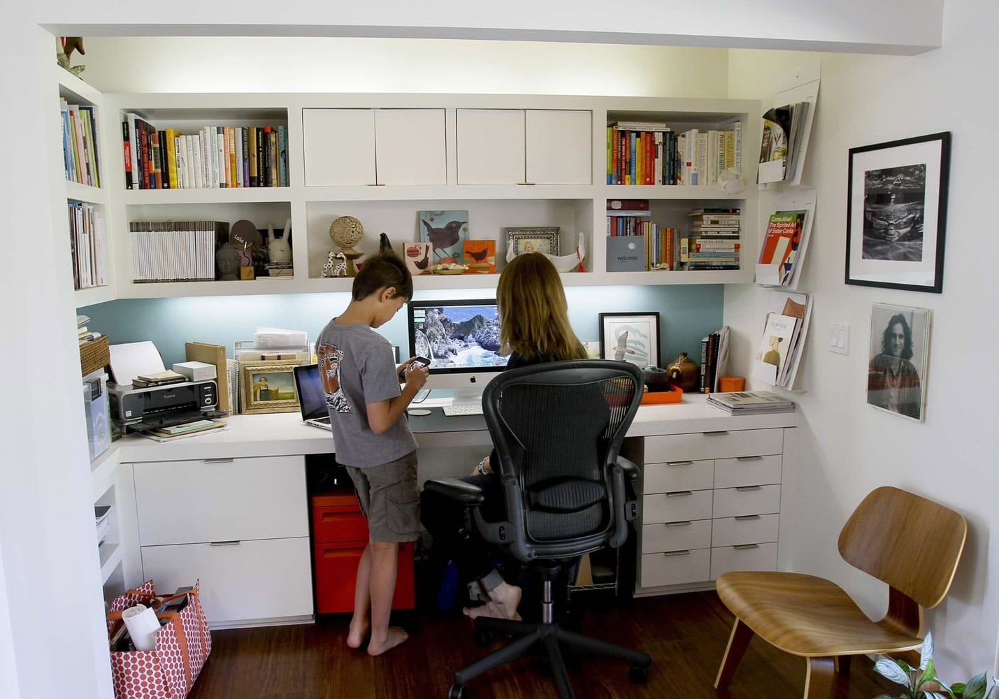 Arley Sakai, 9, talks to his mother, Wanda Weller-Sakai in her office at the family's home in Ojai, California, on March 2, 2012. The home is a 1970's ranch house recently remodeled in a modern style.