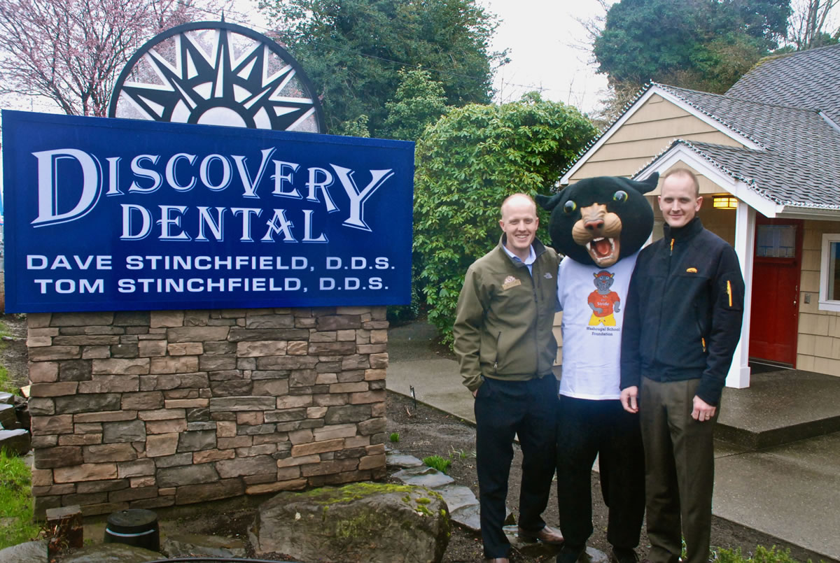 Drs. Dave and Tom Stinchfield of Discovery Dental, in Washougal, are challenging participants in Saturday's Student Stride for Education 5K run to &quot;Beat the Docs.&quot; Both men, avid runners, will be wearing their Stride shirts with a red target on their backs.