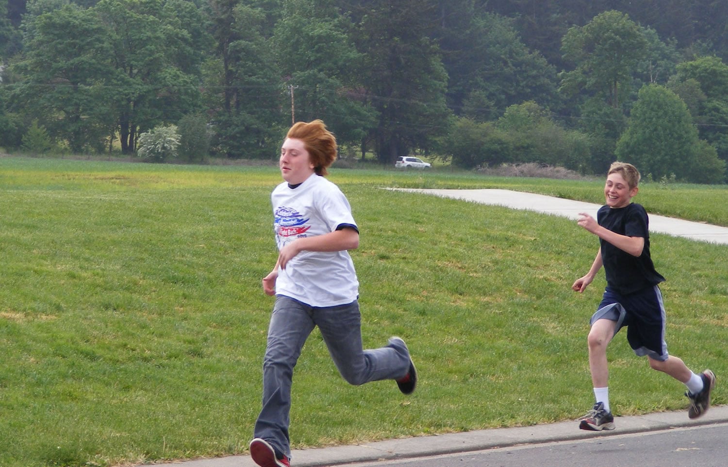 Battle Ground: Justin Fletcher is in the lead with Kyle Peterson on his tail at the Relay for Life walk/run at Tukes Valley Middle School.