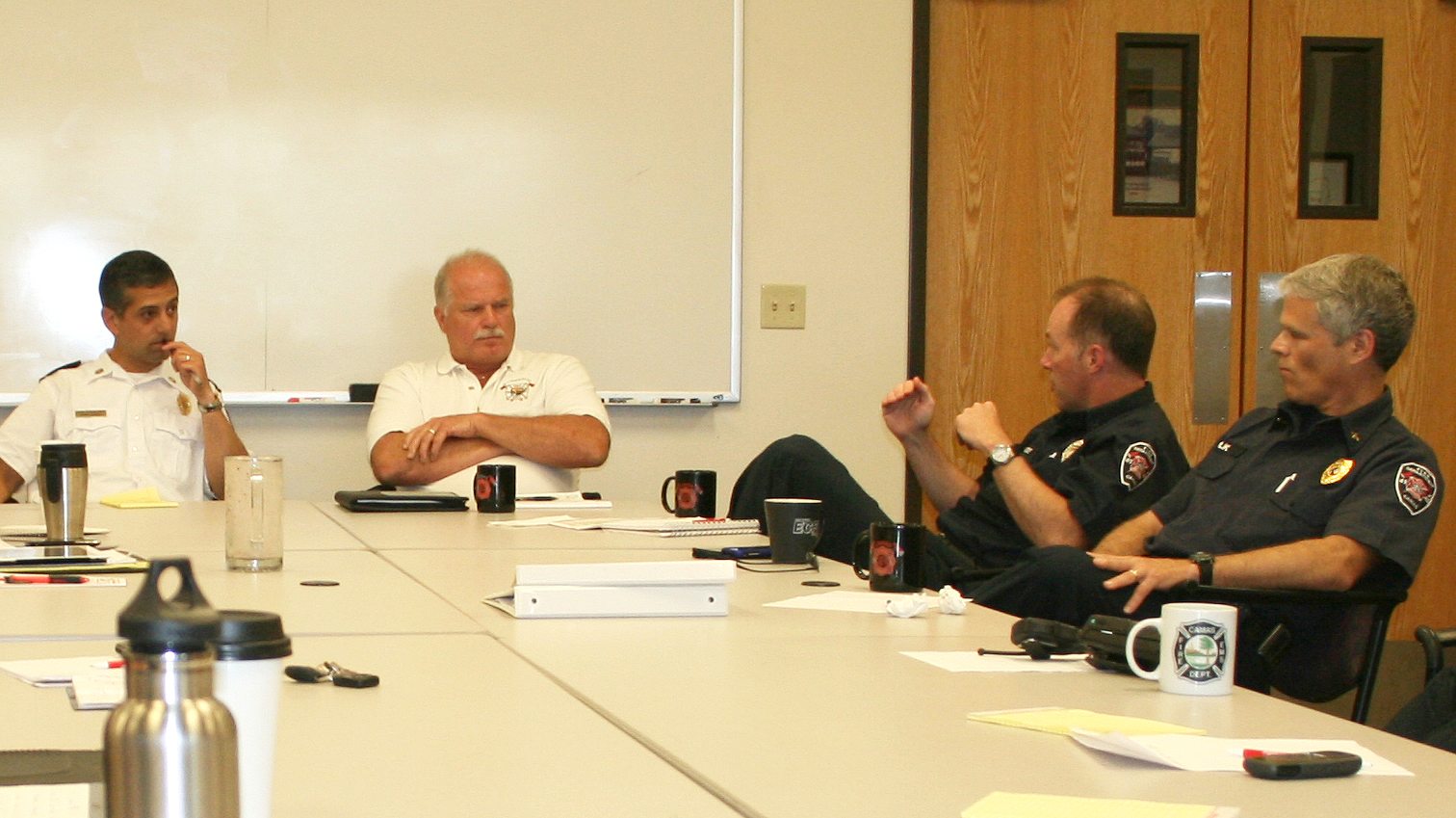 Last Wednesday was the first day of a six-month trial consolidation period between the Camas and Washougal fire departments. The day included the first combined command staff meeting with Camas and Washougal officers. The meetings will be held on a monthly basis. Pictured above (left to right) are Camas Fire Chief Nick Swinhart, Washougal Fire Chief Ron Schumacher, Camas Emergency Medical Services Capt.