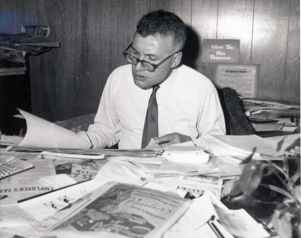 Hal is shown above at his legendary desk in his Post-Record office in April 1966, with papers displayed visibly.