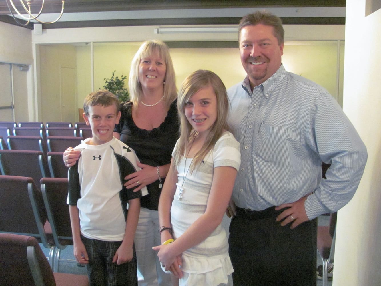 Wendi and Chris Dierickx and their children Dalton and Ashton, stand in the chapel at Straub's Funeral Home. The business is celebrating its 100th anniversary in downtown Camas. &quot;It is quite a milestone,&quot; Chris said.