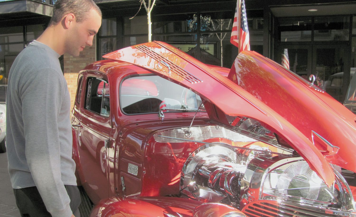 Garrett Erickson of Camas checks out one of the many vehicles on display at the Braggers Rights Classic Car Show, sponsored by Georgia Pacific.