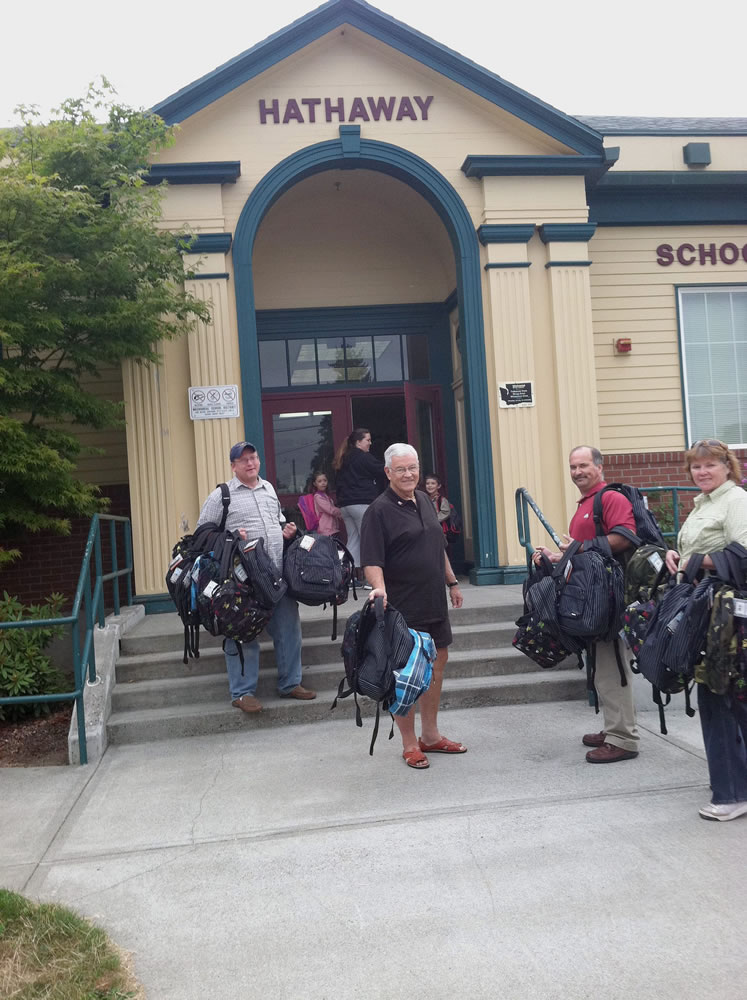 Members of the Camas-Washougal Rotary Club spent time distributing backpacks to children in need at area schools recently.