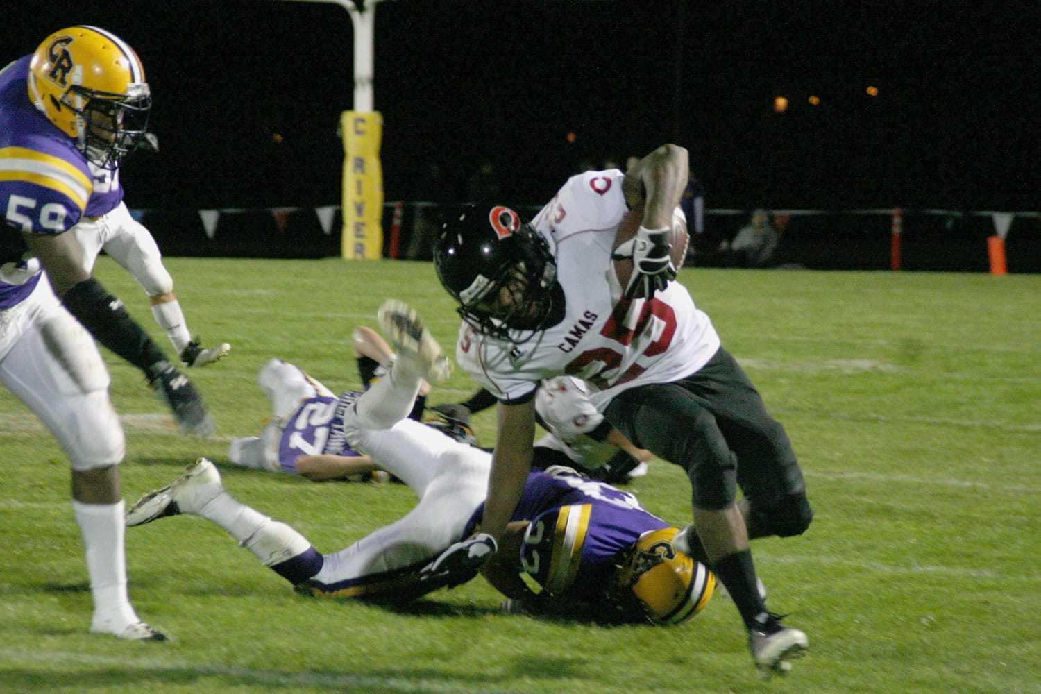 Zack Marshall (25) stamps a first down for the Papermakers Friday, at Chieftain Stadium.