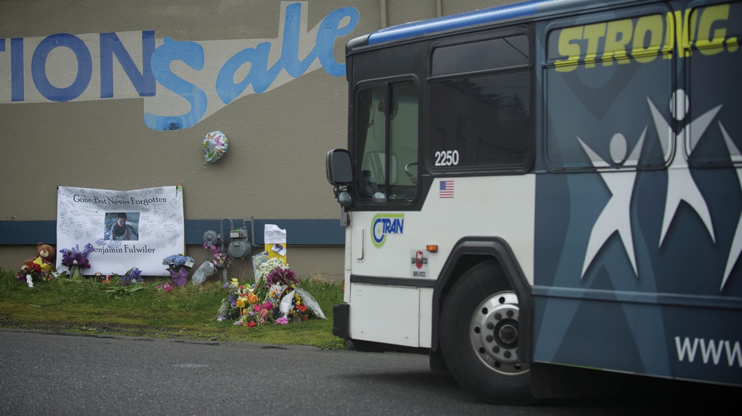 A C-Tran bus on Monday passes the site where 11-year-old Benjamin Fulwiler collided with a C-Tran on Saturday.