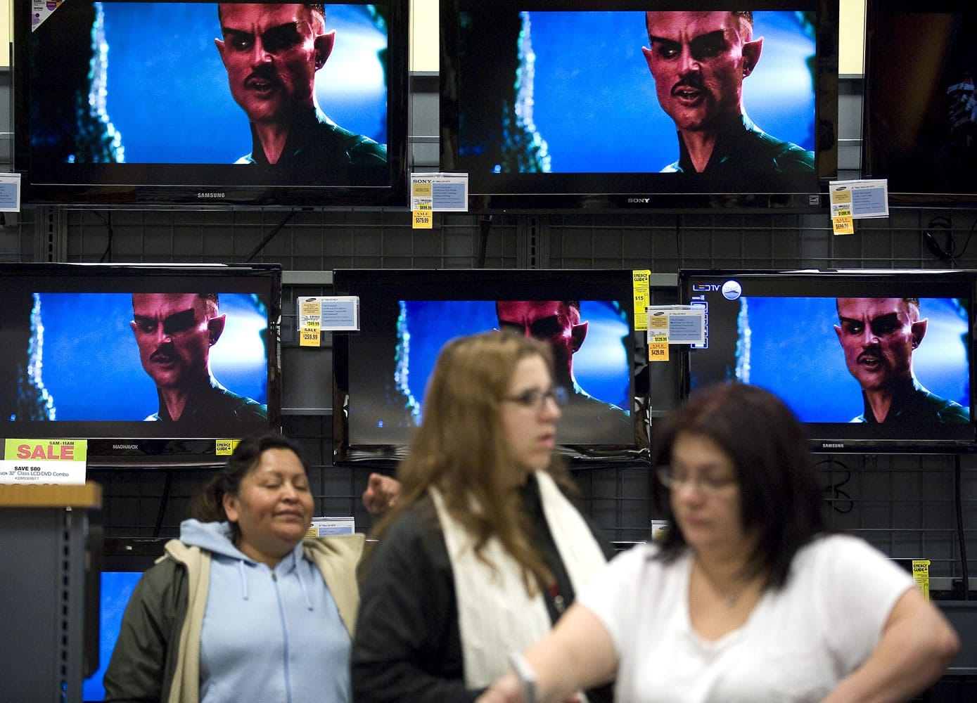 Shoppers browse the Fred Meyer electronics department during Black Friday sales.