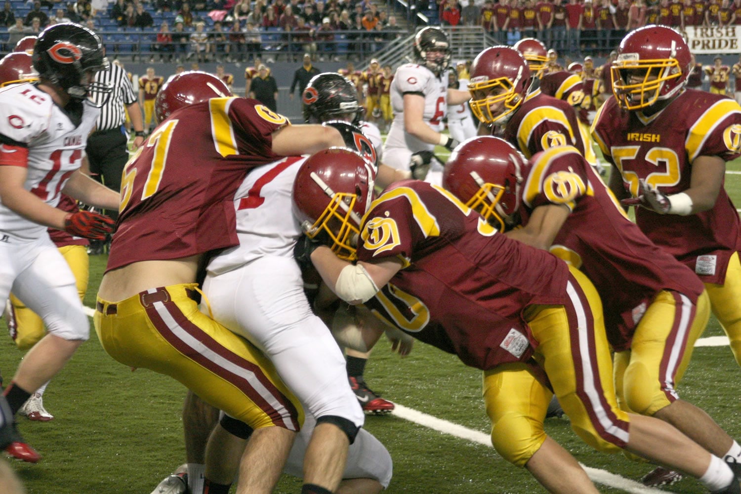 O'Dea puts the squeeze on Camas running back Nate Beasley Friday, at the Tacoma Dome.