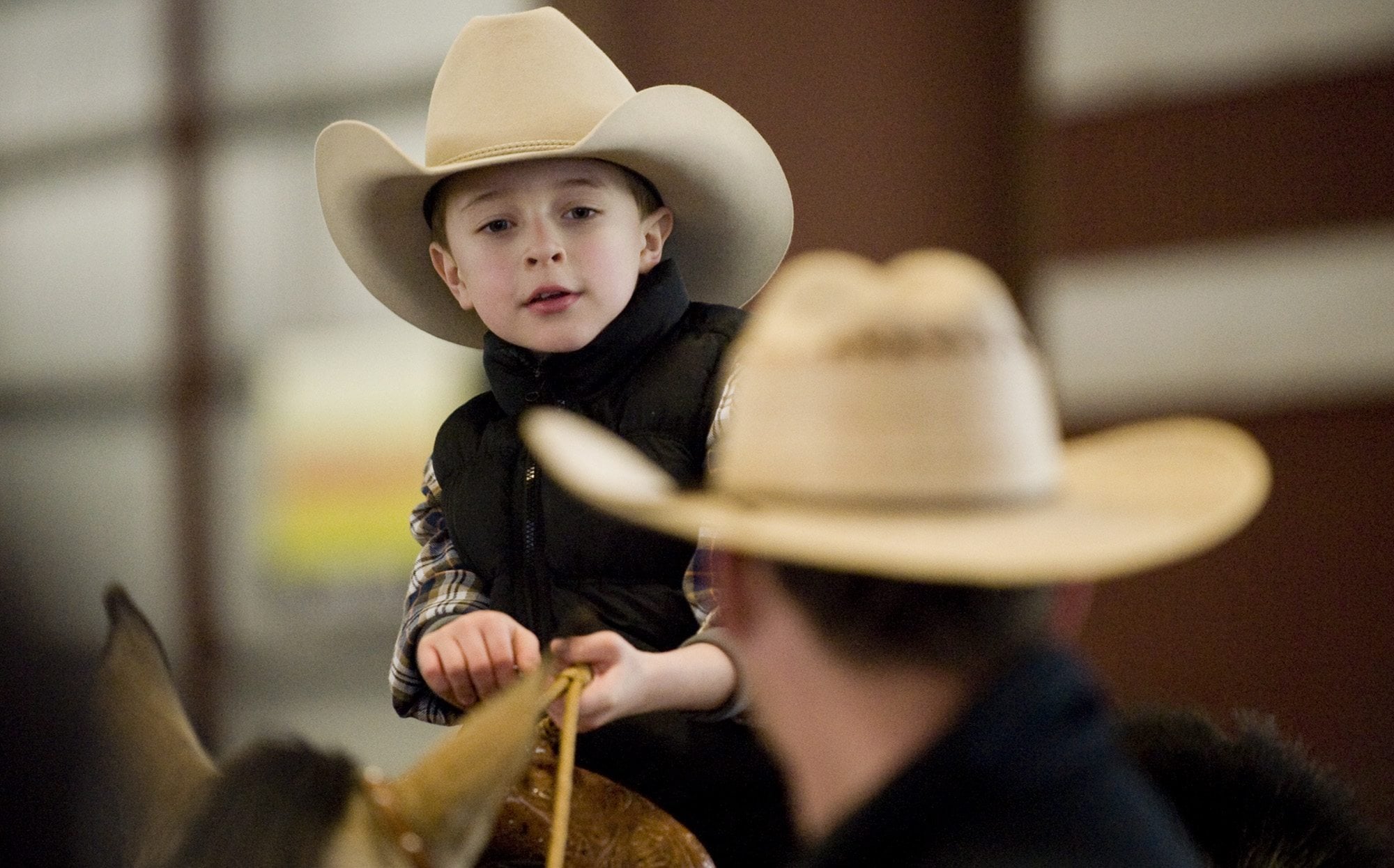 Dane Bardue, 6, and his uncle Luke Bardue attend the Winter Woolies horse show at the Jack Giesy horse arena at the Clark County Fairgrounds in February 2011.