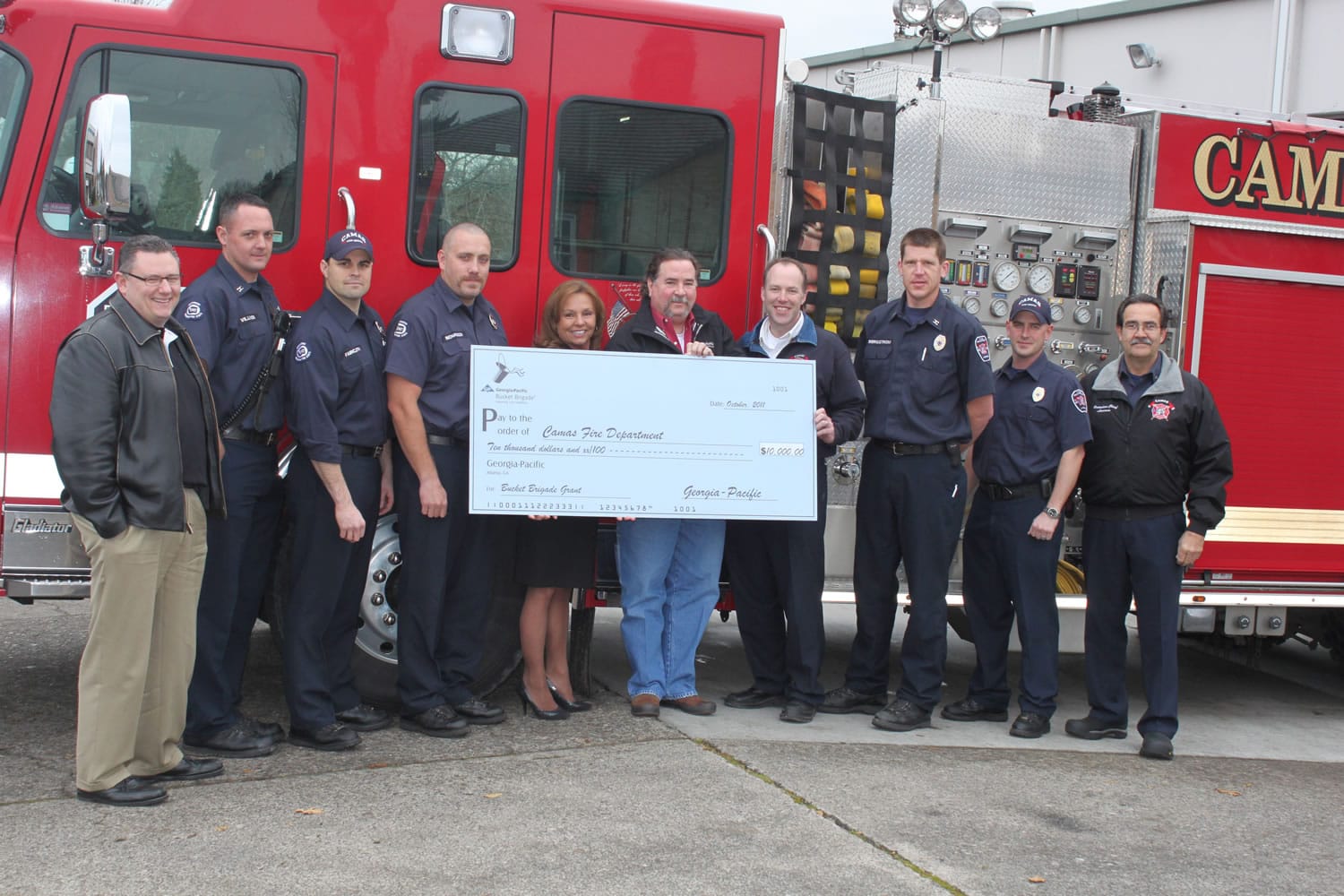 Georgia-Pacific officials presented a check for $10,000 to the Camas Fire Department.
