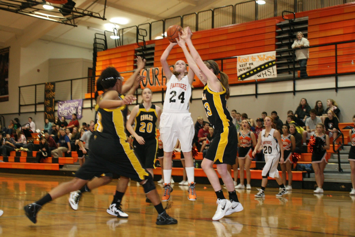 Maddie Down shoots and scores over three Hudson's Bay defenders Monday, at Washougal High School.