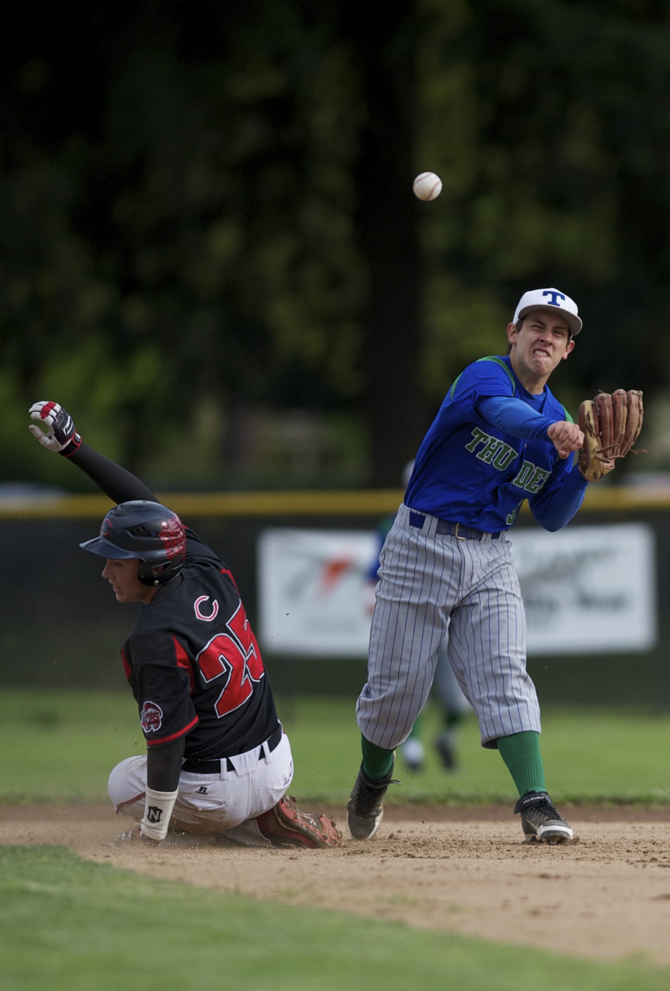 Mountain View's Michael Nino turns a double play after getting out Camas's Jace Schumacher at second base.