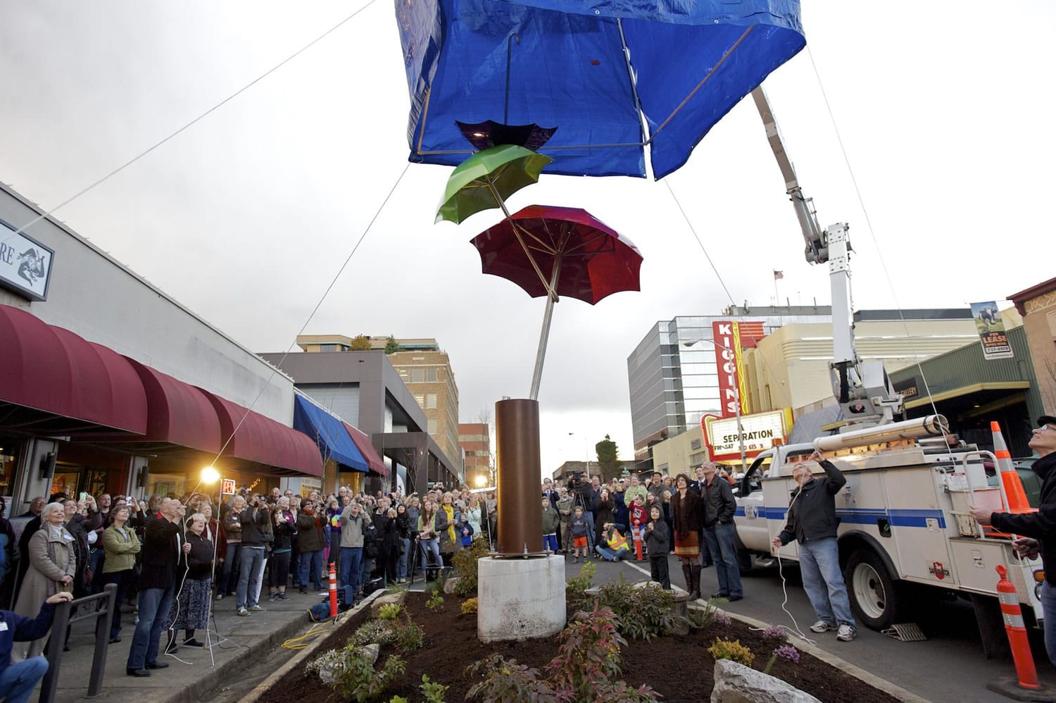 More than 200 people attended the unveiling of &quot;Flying Umbrellas&quot; on Friday evening in downtown Vancouver.