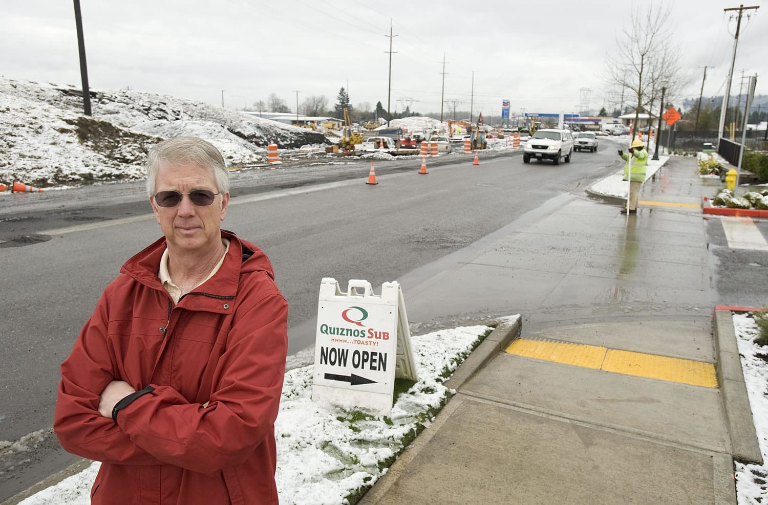 Washougal Quiznos owner Mitch Hammontree said restaurant sales are down by more than 50 percent because the sandwich shop is obscured from view by a mound of dirt brought in to rebuild interchanges on state Highway 14.