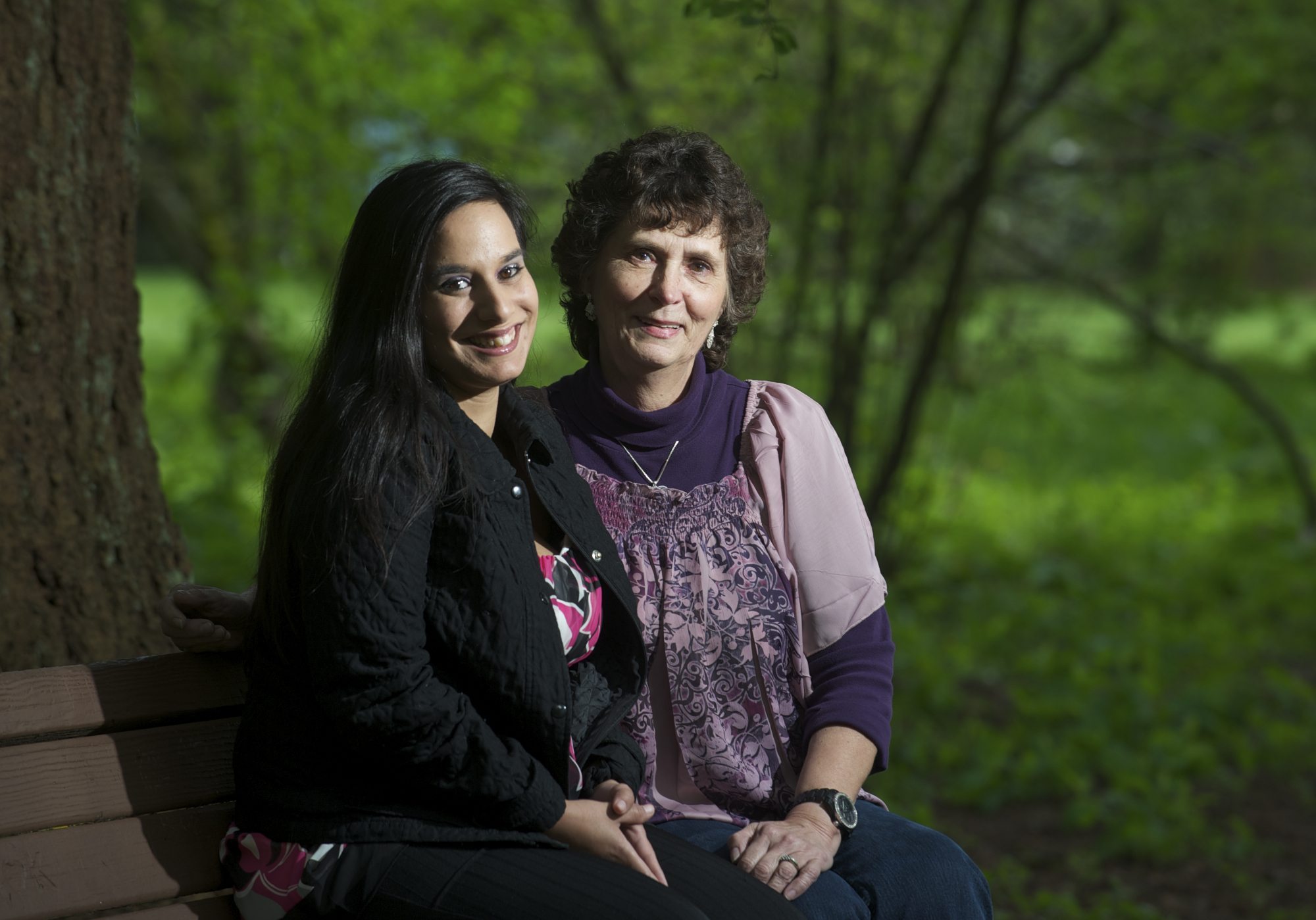 Carol Springer and her daughter Tiffany, 27, pose for a portrait at Orchards Park on Friday. Springer is being honored for years of service as a foster parent.