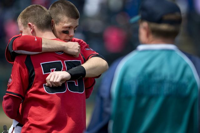 Camas High School's Austin Barr, right, gives his teammate and starting pitcher Kurt Yinger a hug after losing to Shorewood in the 3A state semifinal baseball game at Cheney Stadium in Tacoma on Friday May 27, 2011.