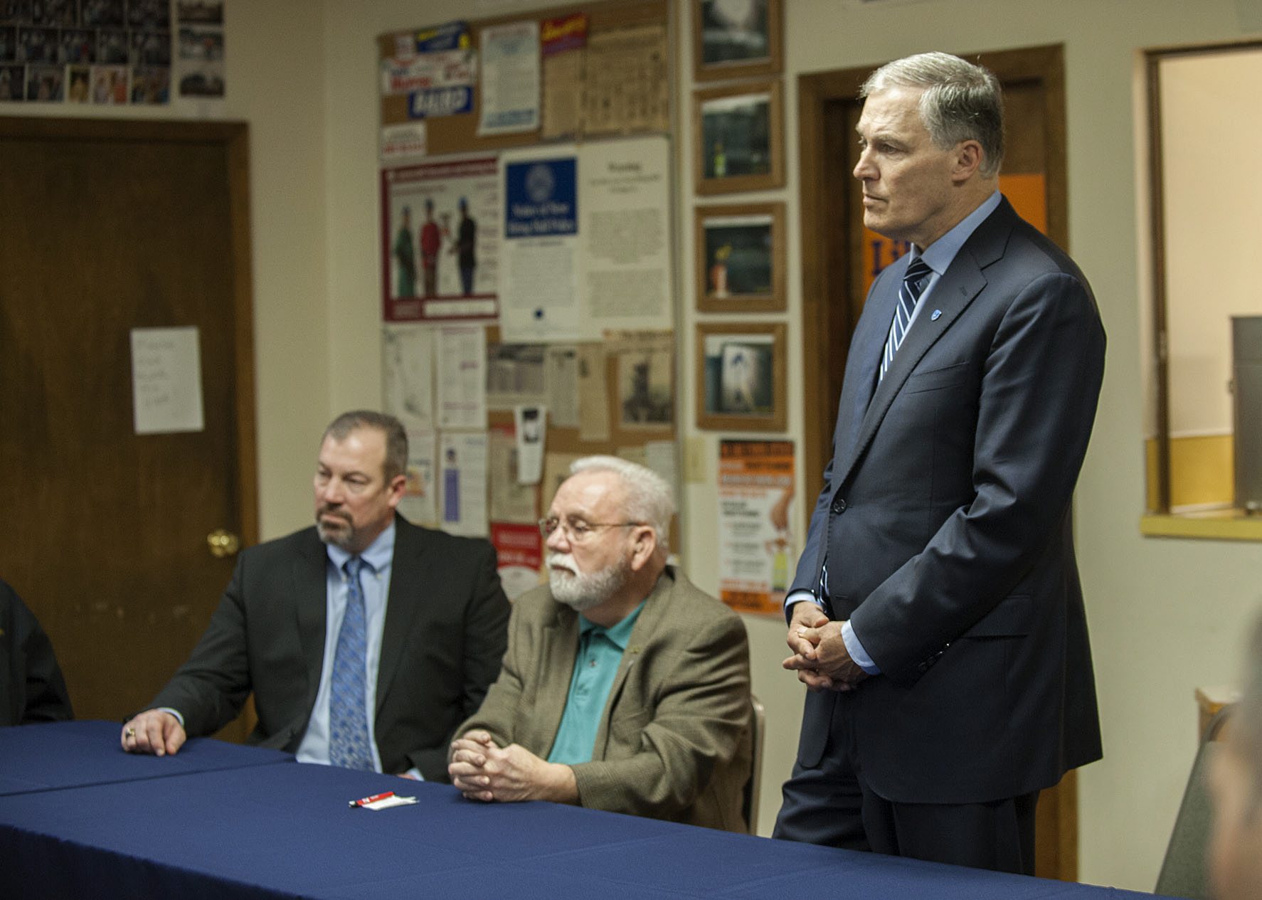 Gov. Jay Inslee, right, listens to questions from members of the Labor Round Table on Wednesday at the Laborers International Union hall in Vancouver.
