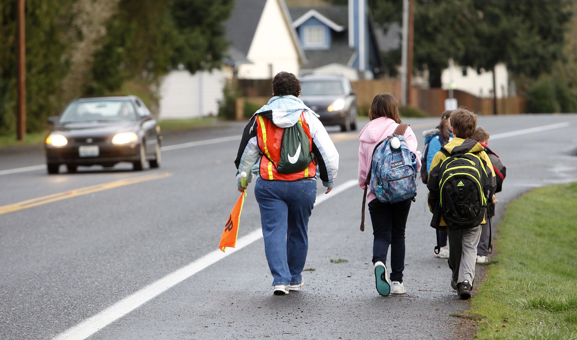 One of two &quot;walking school bus&quot; groups at Sacajawea Elementary School travel along Northeast Hazel Dell Ave.