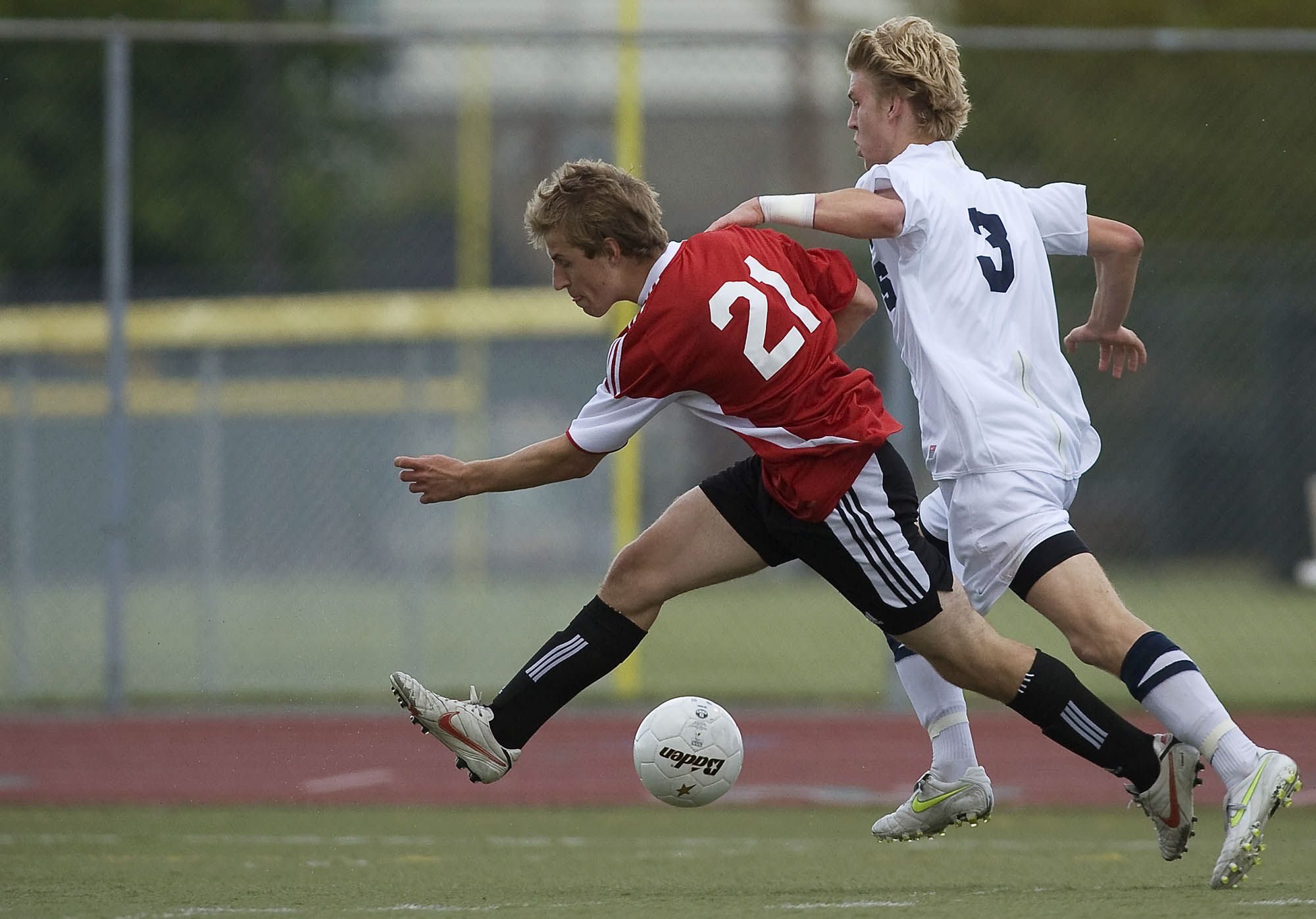 Camas High School's Nathan Beasley tries to battle past Southridge defender Connor Cravens in the second half  Friday.