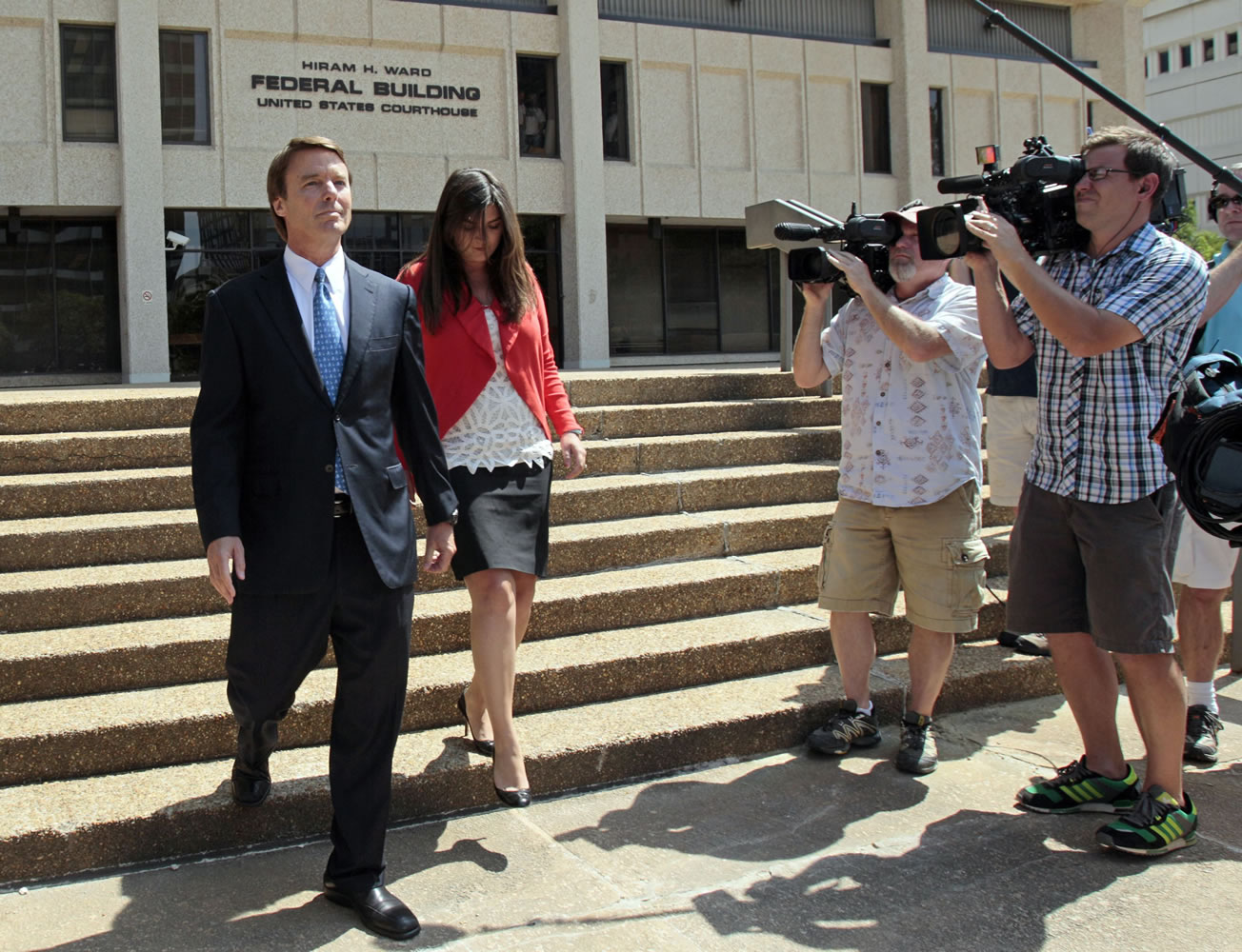 Former presidential candidate John Edwards is seen with his daughter Cate following a court appearance in Winston-Salem, N.C., Friday.