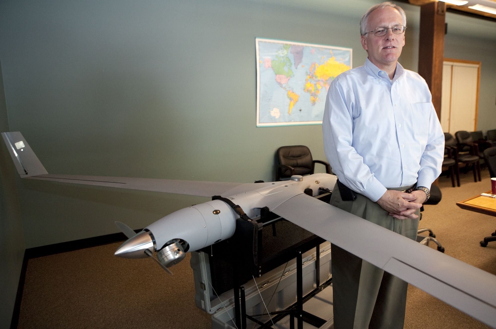 Steve Morrow, president and CEO of Insitu Inc., with a model of the company's ScanEagle unmanned aircraft.