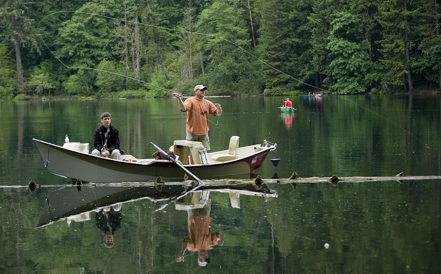Jeff Picard, right, and his son, Caleb, 14, of Hockinson find the fishing relaxing Sunday at Battle Ground Lake.