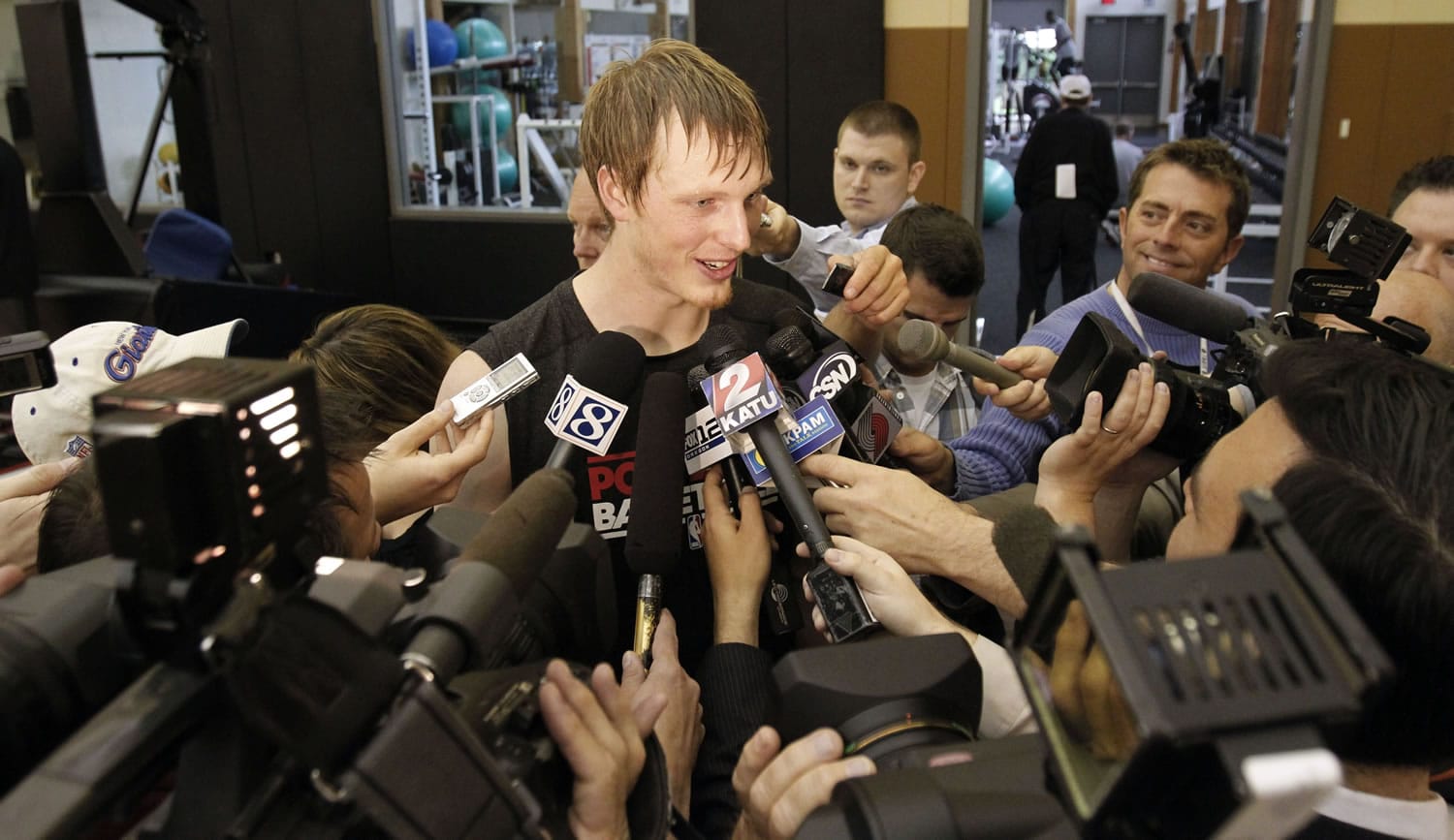Former Duke forward Kyle Singler is surrounded by media after a pre-draft basketball workout at the Portland Trail Blazers practice facility in Tualatin, Ore., on Thursday.