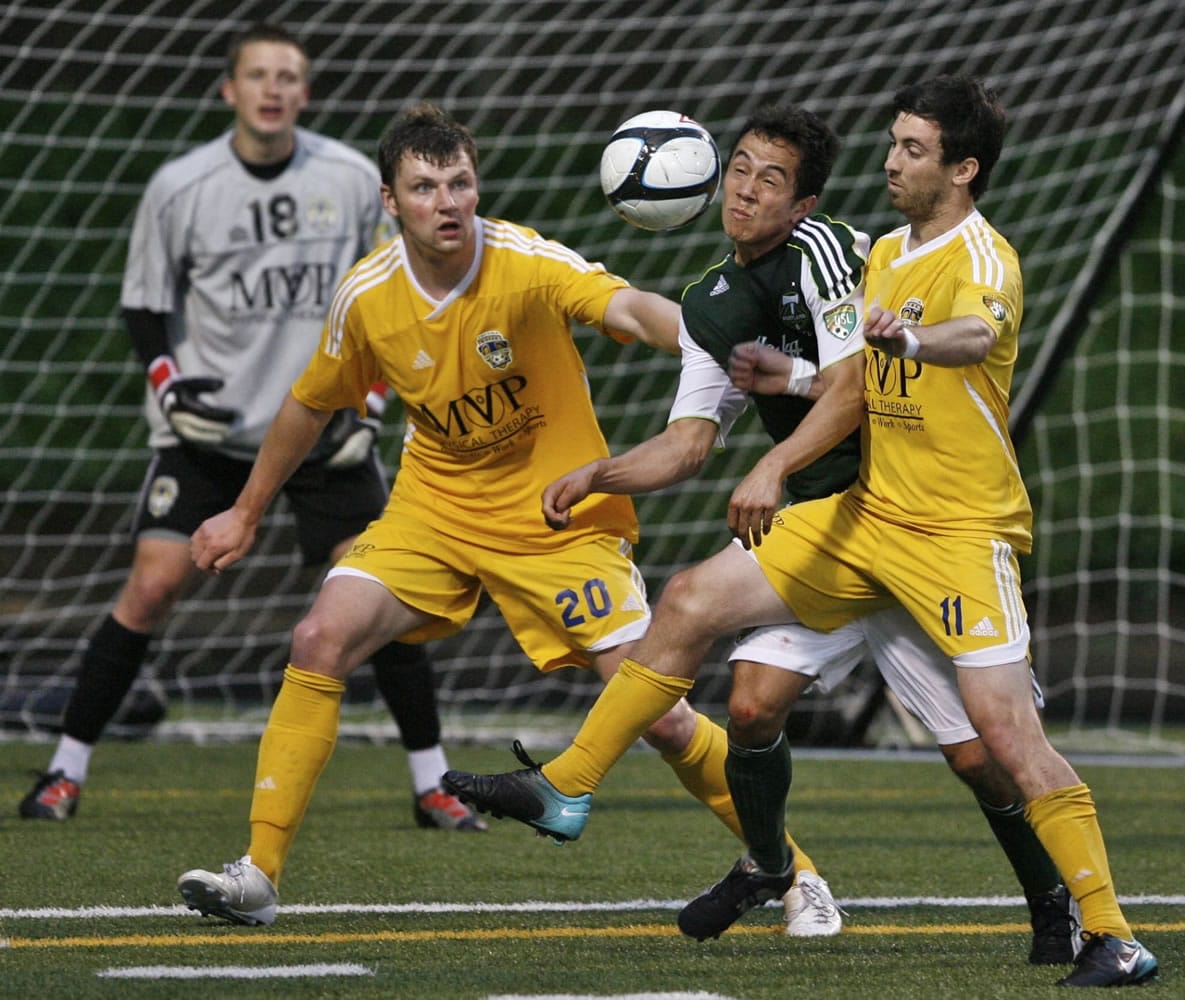 Portland Timbers U-23 forward Brent Richards, center foreground, a Camas High School graduate who also plays for the University of Washington, is defended by Tacoma's players Vanya Popov (20) and Daniel Gray (11) Saturday at Kiggins Bowl in Vancouver. Richards had an assist in Portland's 4-0 victory.