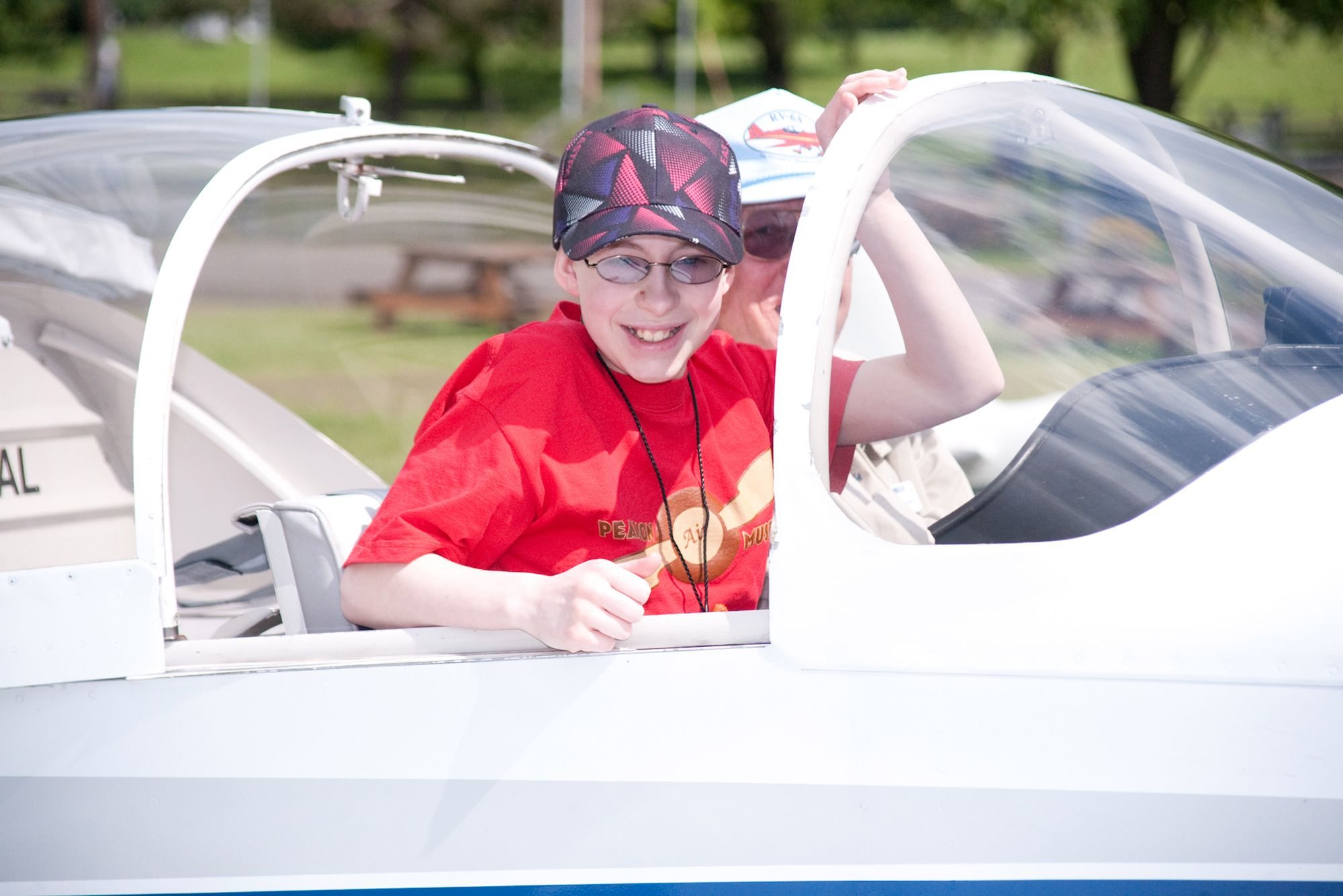 Kaya Galbraith, 13, was among the lucky students who received a free airplane ride during Pearson Air Museum's Open Cockpit Day.