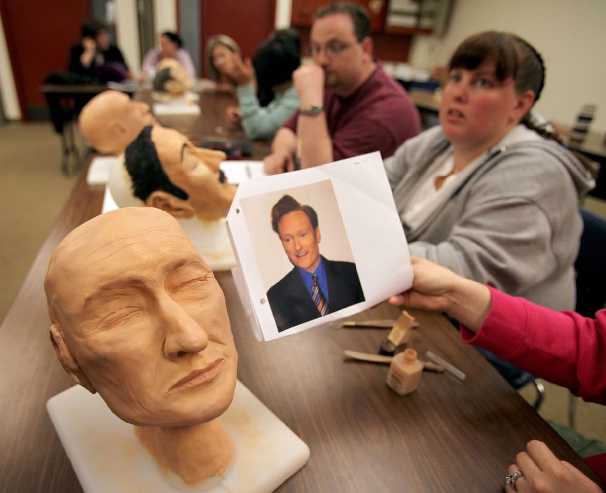 Randi Cloud shows a wax figure she made to resemble television talk-show host Conan O'Brien June 14 in Kirkland.