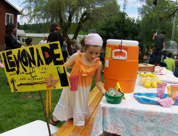 Fairgrounds: Isabel Peters, 8, sells lemonade during The Gardner School fundraiser for the American Cancer Society.