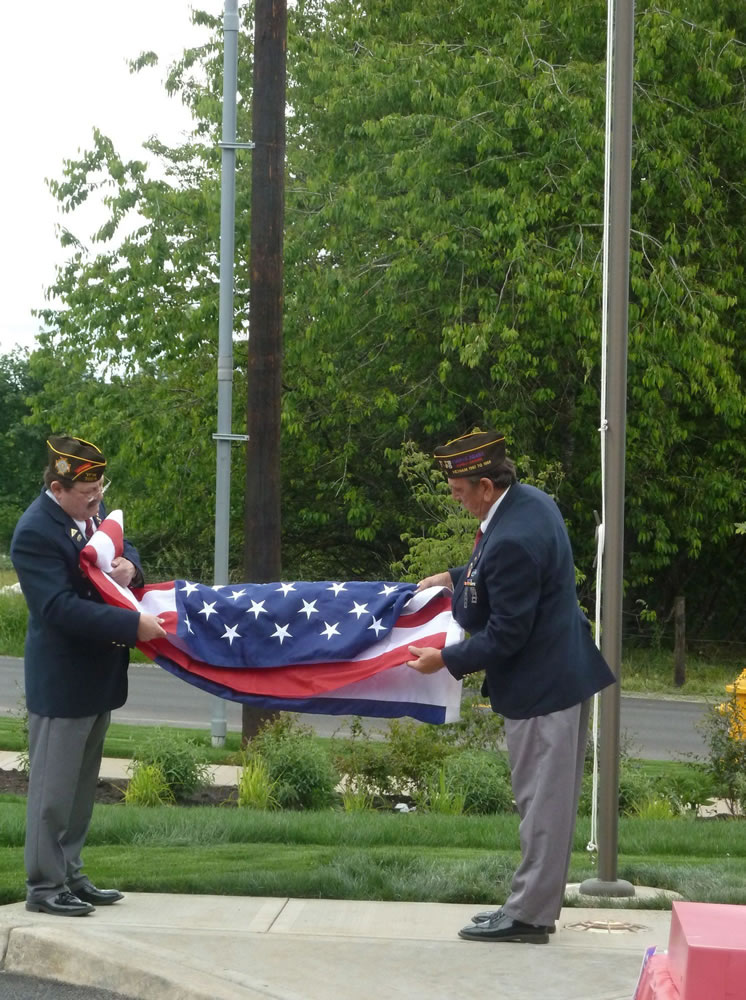 Salmon Creek: Richard Alvarez, left, and Ron Frisbee from the Veterans of Foreign Wars performed a flag-raising ceremony at ManorCare Health Service's new facility in Salmon Creek.